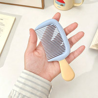 Mini peigne à cheveux en forme de crème glacée, brosse à cheveux portable antistatique en plastique pour les voyages et l'usage quotidien