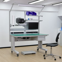 Banc de travail motorisé ESD robuste conçu pour l'assemblage industriel avec réglage de hauteur programmable et design ergonomique