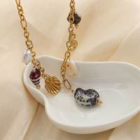 Collier en acier inoxydable 304 sans nickel, plaqué or et rhodium, avec chaîne câble et breloques multiples étoiles de mer et coquillages marins