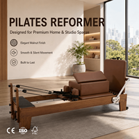 Machine de Pilates Reformer en bois de noyer pour exercices en studio et entraînement de résistance du corps entier
