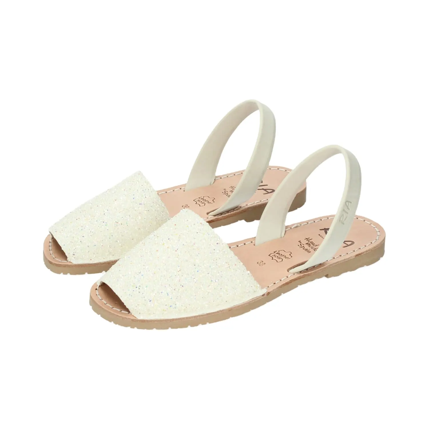 High quality handcrafted menorcan sandals made from sparkling white textile with pigskin lining and rubber sole