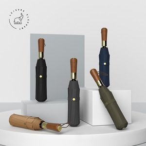 Cadeaux d'affaires <span class=keywords><strong>de</strong></span> marque moderne <span class=keywords><strong>haut</strong></span> <span class=keywords><strong>de</strong></span> <span class=keywords><strong>gamme</strong></span> <span class=keywords><strong>Parapluie</strong></span> pliant entièrement automatique Poignée en bois <span class=keywords><strong>de</strong></span> couleur unie <span class=keywords><strong>Parapluie</strong></span> <span class=keywords><strong>de</strong></span> qualité supérieure - Product Image 2
