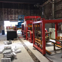 Renseignez-vous sur Qt10-15 Machine automatique de fabrication de briques en béton de ciment Production à grande capacité de briques à feu libre pour Kerbston