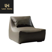Mobilier de salon italien moderne et léger et luxueux Chaise longue de loisirs en cuir avec repose-pieds