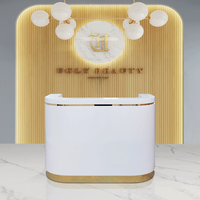 Meubles de salon de beauté de haute qualité, comptoir de réception médical, comptoir de réception luxueux blanc et or pour hôtel et spa