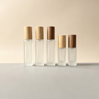 Flacon pulvérisateur cylindrique de luxe en verre dépoli transparent de 10 ml avec bouchon en bois, vente en gros
