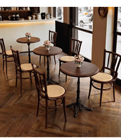 Table de restaurant classique en bois massif avec base décorative en fonte pour bar, bistrot, café