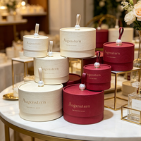Boîtes à fleurs rondes personnalisées Augenstern, boîtes cadeaux cylindriques crème et rouge OEM ODM avec poignées en perles pour arrangements floraux
