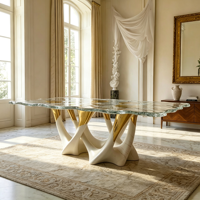 Table à manger en verre ondulé de luxe, base sculpturale artistique avec accent doré pour villa et maison de luxe