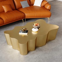 Table basse moderne en acier inoxydable argenté, forme nuage irrégulière, bord ondulé sculptural, table de salon de luxe