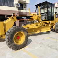 Niveleuse Caterpillar 140K d'occasion - Multifonctionnelle pour le nivellement Prix abordable avec 1 an de garantie