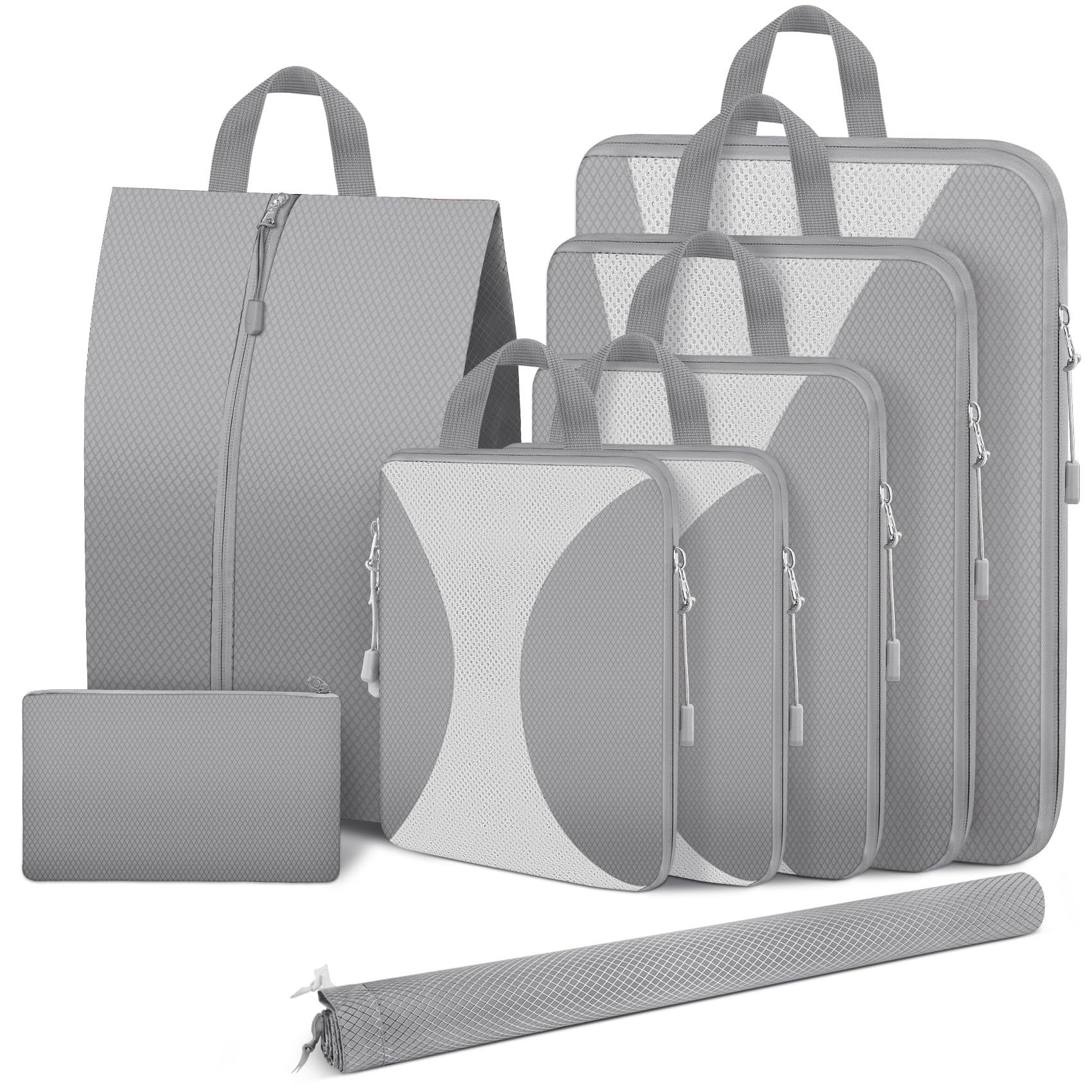 Open suitcase packed with KAYANU compression cubes