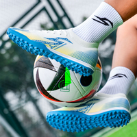 Chaussures de football AG avec semelle durable à rebond élevé pour terrain synthétique, hommes, femmes, jeunes, entraînement quotidien, OEM disponible, vente en gros