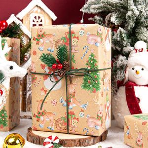 Papel de regalo navideño de papel kraft con diseños de renos navideños, muñecos de nieve y árboles de Navidad, personalizable. - Product Image 1