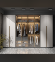 Solution de Rangement Moderne : Armoire Bicolore Blanc & Marron à Trois Portes, Tiroirs, Éclairage Intelligent Chaleureux, Penderie et Rangement Pliant