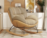 Fauteuil à bascule moderne en tissu texturé avec design ergonomique et structure métallique, chaise longue confortable pour salon ou chambre d'enfant