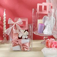 Sac à main en PVC transparent avec logo personnalisé imprimé réutilisable et élégant design avec décoration de ruban pour l'affichage de cadeaux d'anniversaire de mariage
