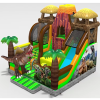 Structure gonflable à thème volcan dinosaure avec toboggan, combo de jeux gonflables pour enfants, idéal pour les fêtes en plein air et les aires de jeux.