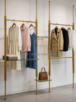 Étagère murale en métal doré personnalisée, étagère de présentation en métal pour boutique de vêtements