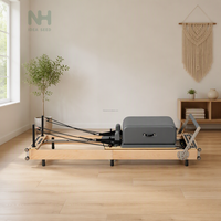 Machine de Pilates pliable en bois massif avec ressorts pour studio de gym et rééducation physique