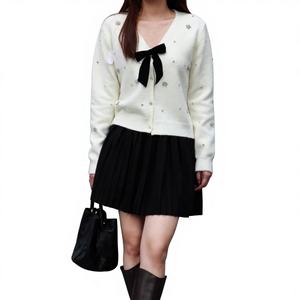 <span class=keywords><strong>V</strong></span>êtements féminins transfrontaliers pour le commerce extérieur : Cardigan à col en <span class=keywords><strong>V</strong></span>, <span class=keywords><strong>pull</strong></span> en maille à nouer avec nœud floral, doublure en laine, vente en gros - Product Image 1