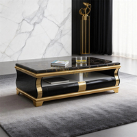 Table basse de luxe en marbre noir avec espace de rangement pratique et piètement en acier inoxydable doré pour salon