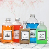 Vente en gros Bouteille en verre transparente transparente avec bouchon à vis Cadeau givré Bouteille en verre de boisson Support personnalisation sérigraphie