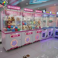 Machine de jeu de grue d'arcade de jouet rose commerciale Machine de poupée de système de paiement de jeton de mini machine de griffe à pièces adaptée aux enfants