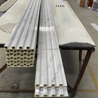 Panneaux Muraux Intérieurs Cannnelés Revêtement PVC Effet Marbre Blanc Bois 3D Panneaux Muraux WPC Habillage Mural Fabricants Foshan