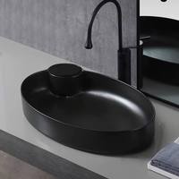 Lavabo ovale moderne avec égouttoir, facile à nettoyer, aspect pierre, entièrement en céramique cristallisée, à poser sur comptoir, noir mat, avec levier