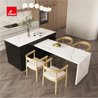 Armoire de cuisine AllandCabinet de style plat en laque blanche et contreplaqué MDF mélaminé brun avec îlot à deux tons et plan de travail blanc
