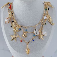 Nouveau collier ras du cou multicouche avec pendentifs étoile de mer, hippocampe, coquillage, coquille de tortue et perle