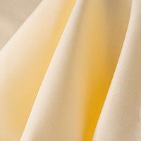 Vêtements 130gsm matériel élasthanne gros tissé rouleau microfibre 4 voies extensible sergé Srubs Polyester tissu pour chemisier