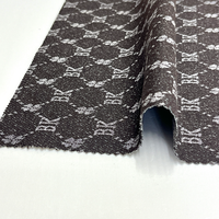 Tissu en denim jacquard noir et gris avec logo rétro en lettres pour vêtements, vestes et sacs