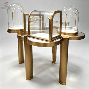 Présentoirs <span class=keywords><strong>en</strong></span> <span class=keywords><strong>verre</strong></span> de luxe pour boutiques, socles colonnes <span class=keywords><strong>en</strong></span> or brossé avec dômes de protection pour la présentation de bijoux et de montres de luxe - Product Image 1