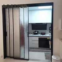 Porte de séparation en verre télescopique en aluminium AOSTTER avec système coulissant multi-voies et grande surface ouverte pour salon de villa
