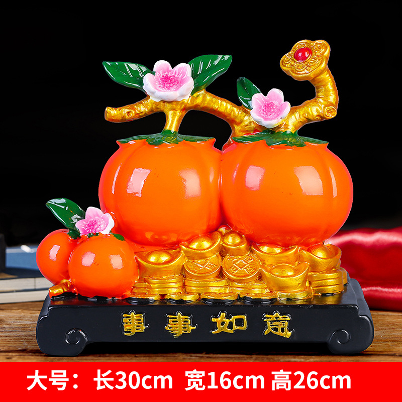 Caquis grandes para la buena fortuna.