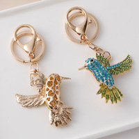 Porte-clés créatif plaqué or avec breloque oiseau, porte-monnaie, en alliage, orné de strass et de cristaux, motif animal, impression typographique