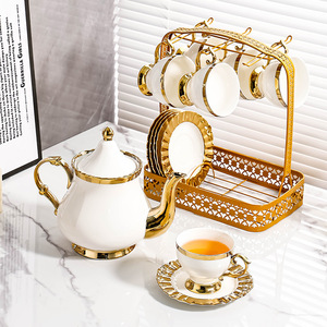 ชุดน้ำชาเซรามิกสีขาวทองหรูหรา พร้อมถ้วยกาแฟและจานรอง ชุดกาน้ำชาพอร์ซเลนพร้อมที่วางโลหะ - Product Image 4