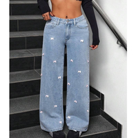 Jean large taille haute en denim bleu clair et rose brodé avec nœuds, coupe ample et décontractée, décoré de mini-nœuds sur toute la surface pour femme