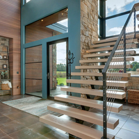 Escalier moderne à poutre simple ouverte avec marches en chêne et garde-corps en câble d'acier inoxydable
