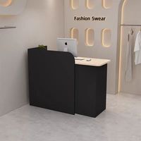 Bureau d'accueil d'angle moderne noir compact en MDF écologique avec éclairage LED, couleur et logo personnalisables, idéal pour les magasins de vêtements féminins - Offre Spéciale