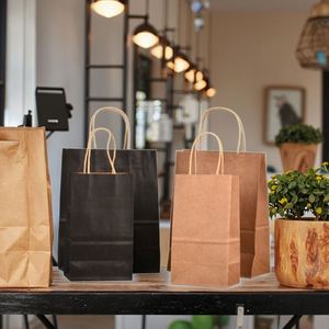 Wholesale Customized Kraft Paper Shopping Bags Twisted Handle Environmentally Friendly Recycled Materials Custom Logo Brand - Product Image 1