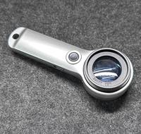 60X Rechargeable LED Handheld Magnifier for Jewellery Appraisal, Coin and Stamp Inspection.