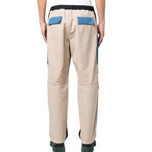 Pantalon cargo beige pour homme avec poches bleues, taille élastique, style workwear, en toile de polyester et coton, respirant, poids moyen - Product Image 2