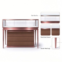 Comptoir de présentation de bijoux en verre or rose moderne avec éclairage LED et tiroirs de rangement en bois pour magasin de détail et salle d'exposition