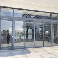 Puertas Correderas de Vidrio Eléctricas Inteligentes Personalizadas con Sensor de Levitación Magnética, Diseño Moderno, Doble Acristalamiento Templado para Entrada de Centro Comercial