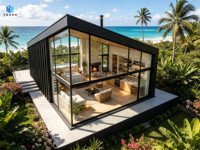 Maison préfabriquée modulaire en métal noir avec grandes fenêtres vitrées pleine hauteur, design moderne pour villa de glamping, bureau ou bâtiment