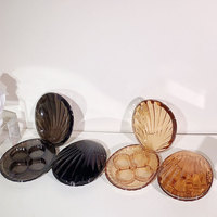 Palette de fards à paupières portable 4 couleurs personnalisée, design populaire en forme de coquille, avec paillettes et emballage cosmétique pour usage professionnel