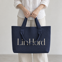 Sac à bandoulière en tricot avec logo personnalisé et poignées courtes et longues pour les collections de boutiques et les tenues de ville quotidiennes